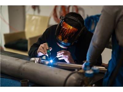 man-working-with-argon-welding-machine-garage-1.jpg
